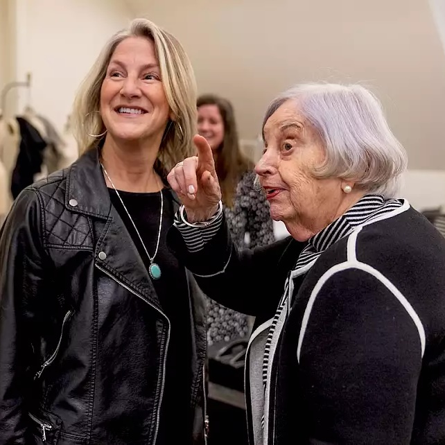 Deborah Christiansen, senior lecturer in fashion design, chats with her mentor, Karla Kunoff, in Kirkwood Hall on the Bloomington campus.