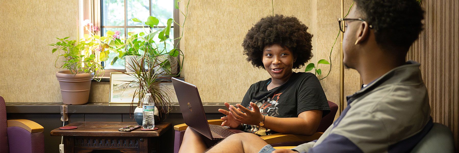 Students talking at the IMP office.