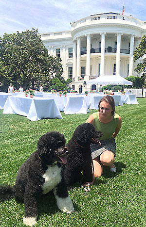 Morgan Mohr on the South Lawn of the White House with the Obama family's pet dogs