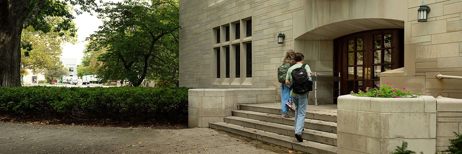 Students walking up stairs into building at Indiana University